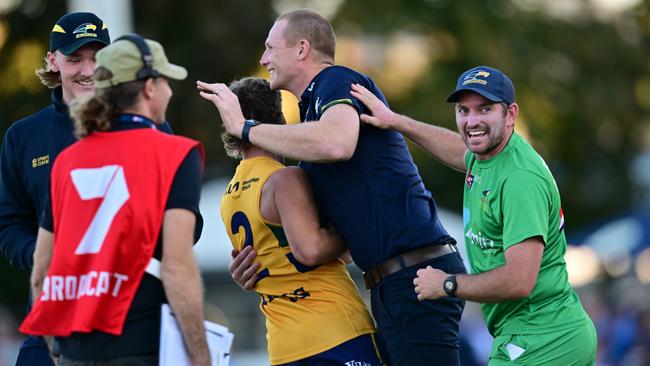 Coach Sam Jacobs (centre) and runner Chadd Sayers celebrate the Eagles’ thrilling Round 5 win against Sturt at Unley Oval. Picture: Scott Starkey/SANFL.