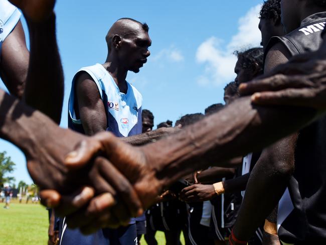 Magpies and Buffaloes players shake hands before the grand final. PICTURE: Elise Derwin