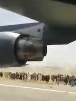 People desperately try to get away at Kabul airport. Picture: Twitter