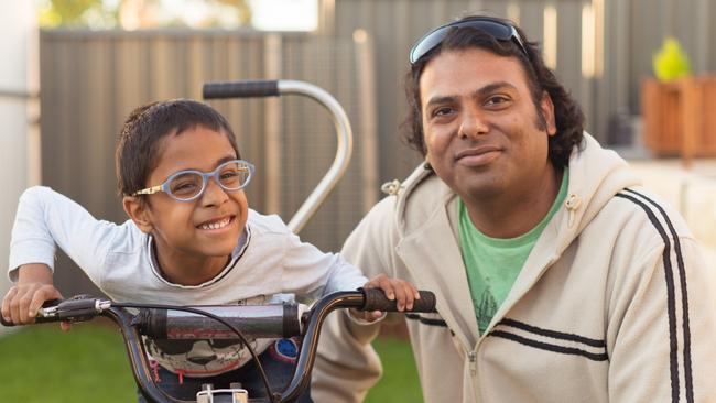 Ram, 6, with his father Harry Renkuntla, 42. Picture: NDIS.