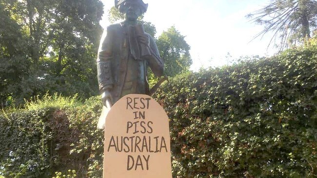 Far-left activists have put up signs at the historic Cooks’ Cottage. Picture: Facebook