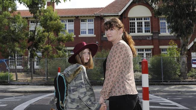 Melissa Callaghan with daughter Lily, then 9, at the Brunswick East Primary School crossing.