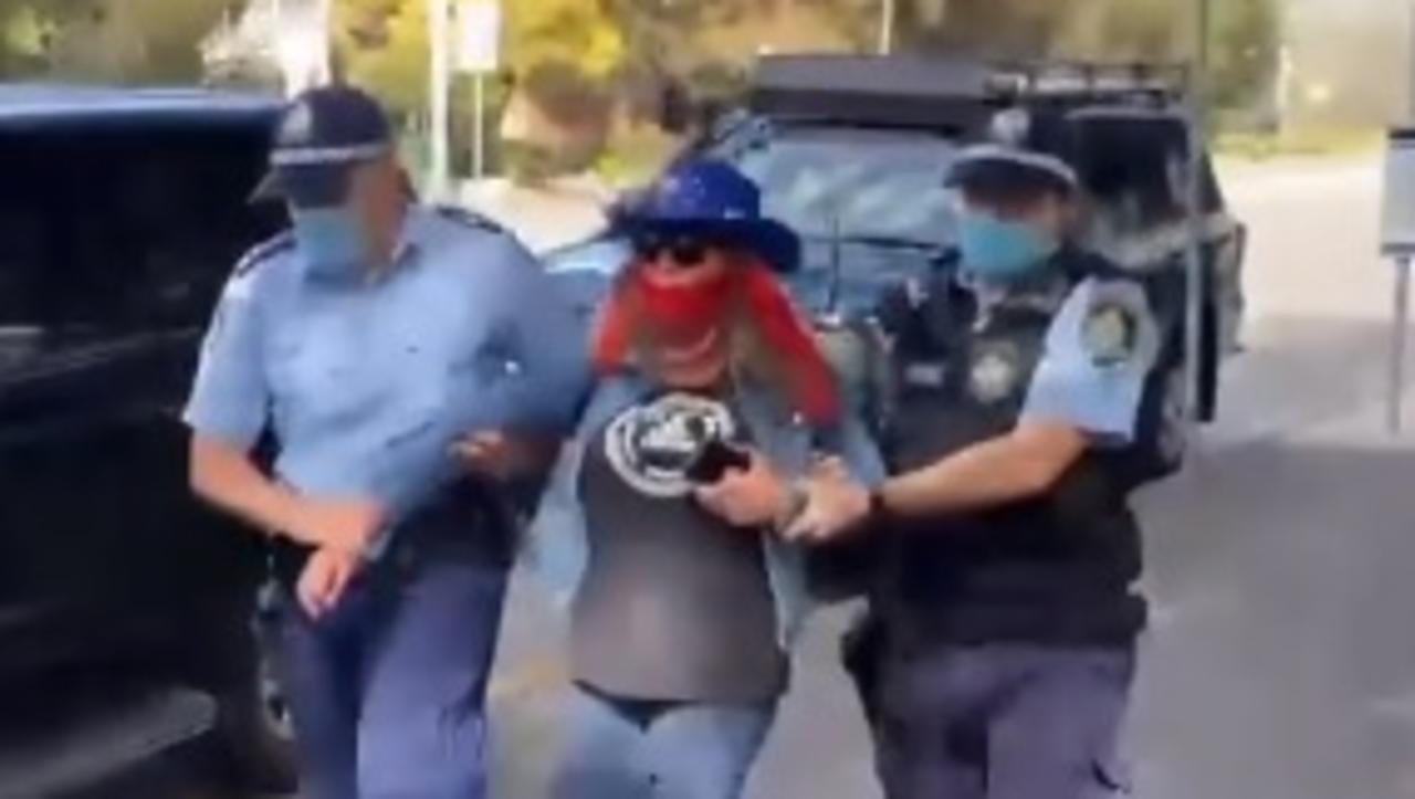 Police lead one anti-lockdown protestor away in Sydney. Picture: Instagram / @laurentomasi