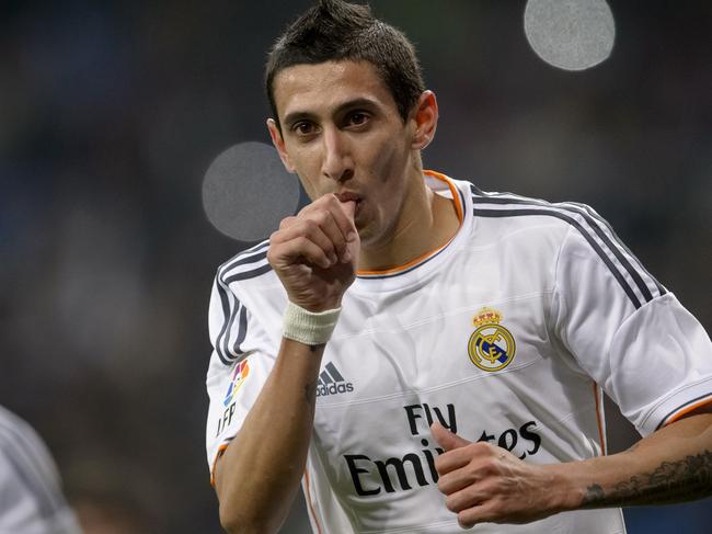 (Files) In this file picture taken on December 18, 2013, Real Madrid's Argentinian midfielder Angel di Maria celebrates after scoring during the Spanish Copa del Rey (King's Cup) finals stage second-leg football match against Olimpic Xativa at the Santiago Bernabeu stadium in Madrid. Manchester United have signed Argentina midfielder Angel di Maria from Real Madrid for a British record transfer fee of £59.7 million ($98 million, 75 million euros), the English Premiership club announced Tuesday, August 26, 2014. The 26-year-old's move, on a five-year contract, shatters the previous British record fee of £50m paid by Chelsea to sign Spain striker Fernando Torres from Liverpool in 2011. AFP PHOTO/ DANI POZO