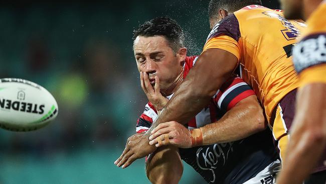 Cooper Cronk gets hit late by Tevita Pangai Jnr. Picture. Phil Hillyard
