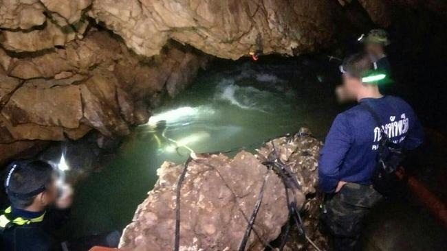 Navy SEAL frogmen in the cave system prepare to rescue the boys before the monsoonal rains.
