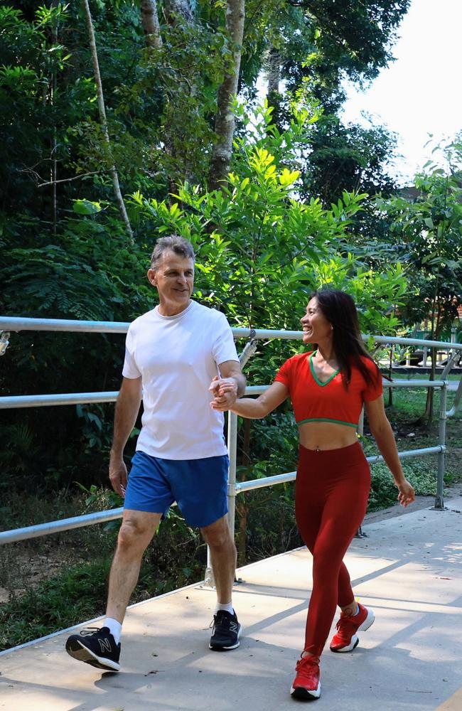 Edge Hill couple Cristy Gelviro and Gary Owens love an active lifestyle, walking together across Freshwater Creek in Goomboora Park, Brinsmead. Picture: Brendan Radke