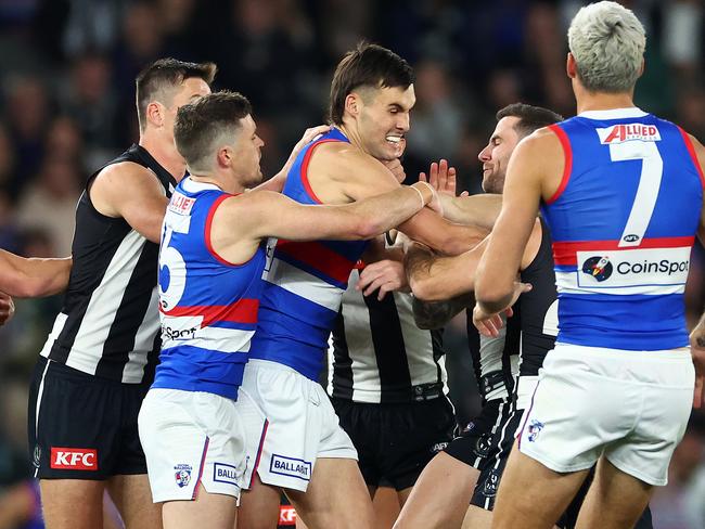 MELBOURNE, AUSTRALIA - MAY 31: Magpies players remonstrate with Sam Darcy of the Bulldogs  during the round 12 AFL match between Collingwood Magpies and Western Bulldogs at Marvel Stadium, on May 31, 2024, in Melbourne, Australia. (Photo by Quinn Rooney/Getty Images)