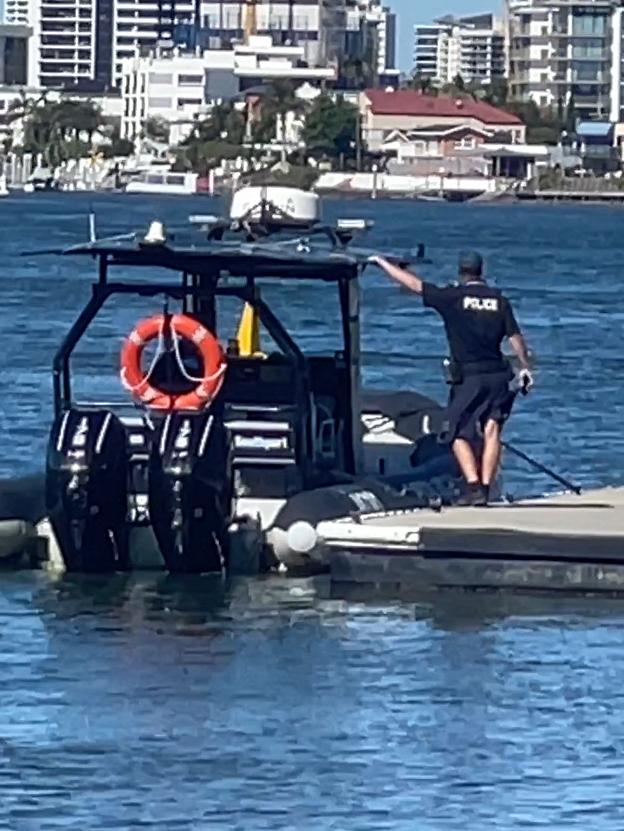 Water police working to recover the vehicle from the Nerang River. Picture: Charlton Hart.