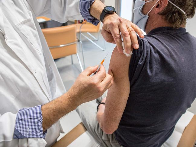 General practitioner Jean Louis Bensoussan administers a dose of AstraZeneca vaccine to a patient in southern France. Only a quarter of supplies have been used. Picture: AFP