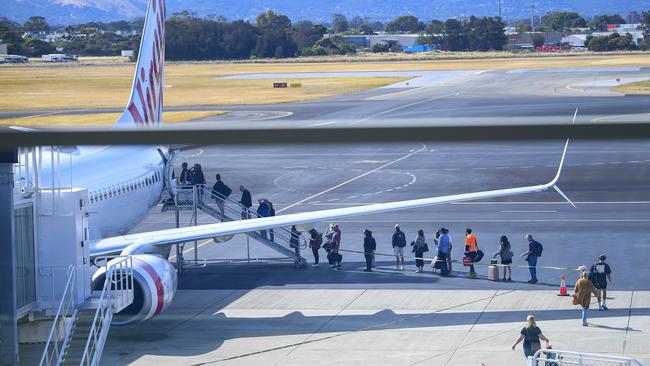 Passengers board a Virgin Australia flight to Sydney at the Adelaide Airport on Thursday. Picture: Mark Brake