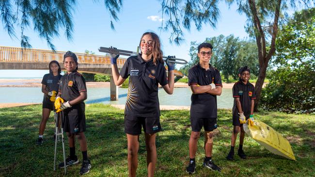 Nightcliff Middle School Clontarf and Stars program kids are out and about at Rapid Creek picking up rubbish for Clean Up Australia Day. Almaray Cadell, Lawrence Johnston, Ruby Mummery, Quentin Berto and Clarkson Johnston are stoked to get out of the classroom and into the outdoors. Photograph: Che Chorley