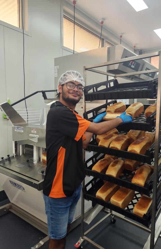 Waylan Pascoe stacking freshly baked bread at the Normanton bakery.
