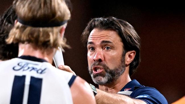 BRISBANE, AUSTRALIA - MARCH 02: Coach Chris Scott of the Cats talks to his players at the 3rd quarter time break during the AFL Practice Match between the Brisbane Lions and the Geelong Cats at Brighton Homes Arena on March 02, 2023 in Ipswich, Australia. (Photo by Bradley Kanaris/Getty Images)