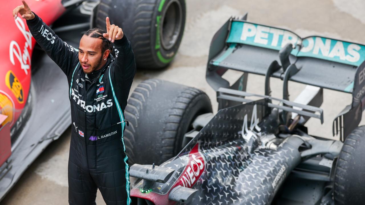 Hamilton stands atop his Mercedes, celebrating victory in Turkey. Picture: Getty Images