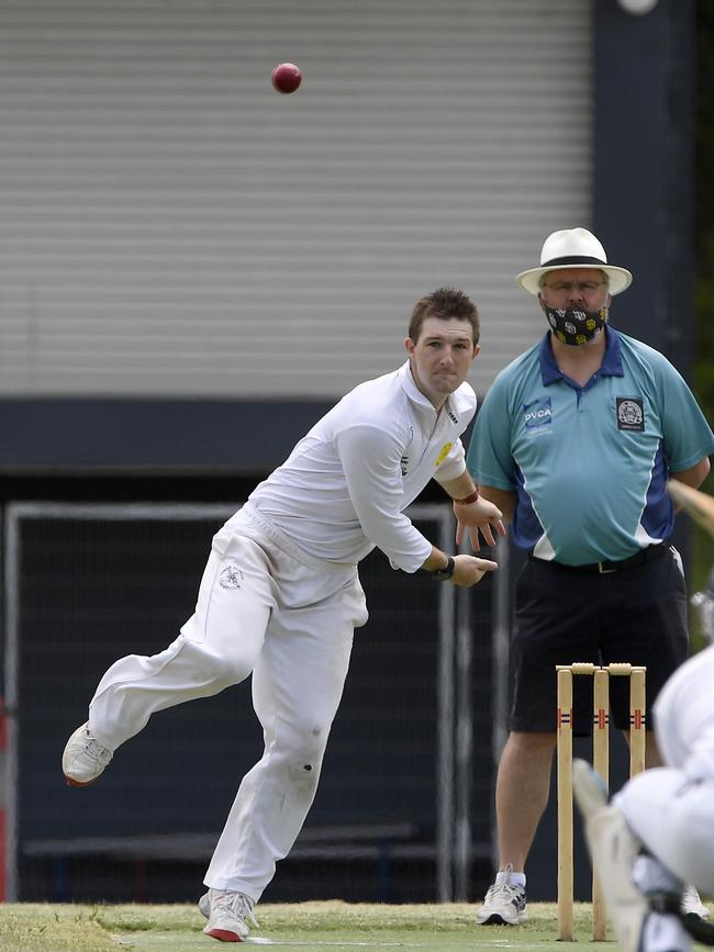 Mackenzie Stanley bowls another delivery.