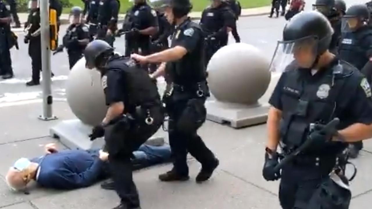 Mr Gugino lying on the ground after being shoved over by police. Picture: Mike Desmond/WBFO NPR/AFP