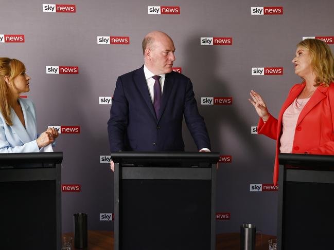 Labor’s Catherine Renshaw and Liberal MP Trent Zimmerman urged Kylea Tink to say who she would side with. Picture: Richard Dobson