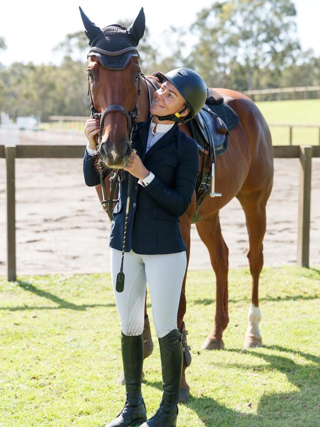 Kathy O’Hara poses for a photo with retired racehorse Nature Strip. Picture: Max Mason-Hubers