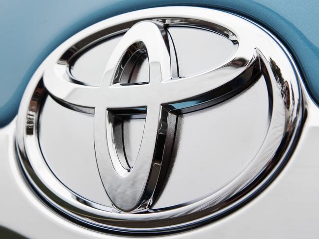 Badge on the 2010 Toyota Camry Hybrid Luxury sedan.