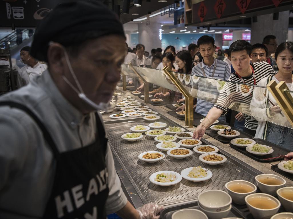 Huawei employees make their choice at the cafeteria production line. Picture: Getty.