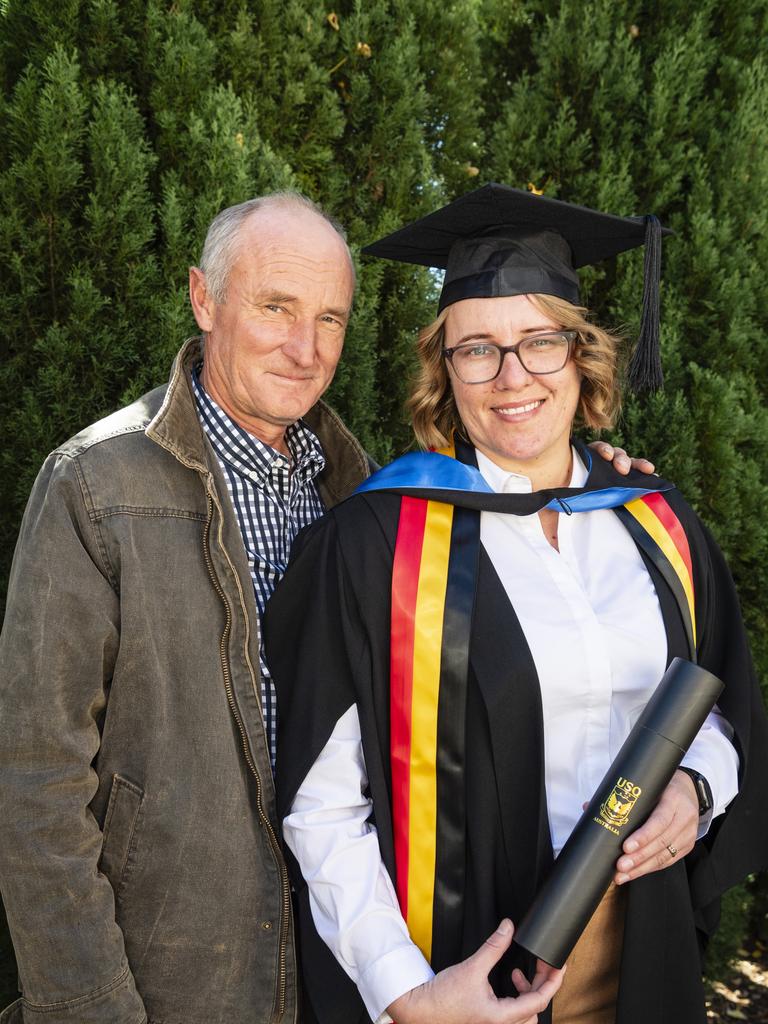 Bachelor of Science (Psychology) and Criminology and Criminal Justice graduate Jessica Monagle is congratulated by her dad Lionel Monagle at a UniSQ graduation ceremony at Empire Theatres, Tuesday, June 27, 2023. Picture: Kevin Farmer