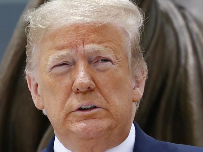 President Donald Trump and first lady Melania Trump visit Saint John Paul II National Shrine, Tuesday, June 2, 2020, in Washington. (AP Photo/Patrick Semansky)