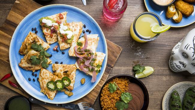 Quesadilla and refried beans and another round of drinks.