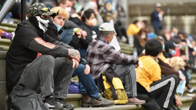 Masked protesters arrived an hour early. Picture: Jason Edwards