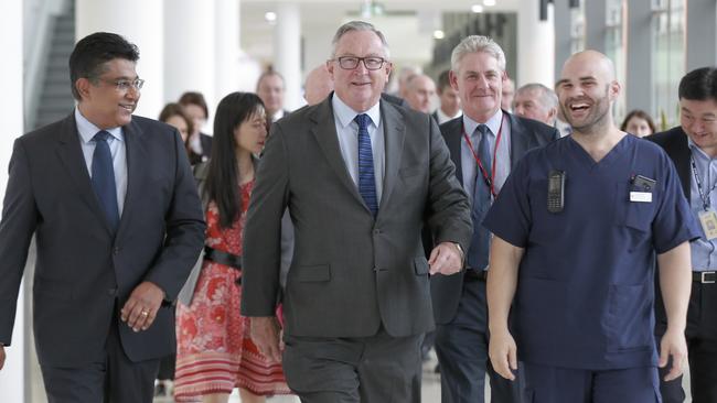 NSW Health Minister Brad Hazzard and key hospital staff heading to inspect the cath lab at Liverpool Hospital.