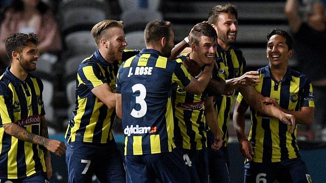 The Mariners’ Jake McGing celebrates his goal against Sydney FC on Friday night.