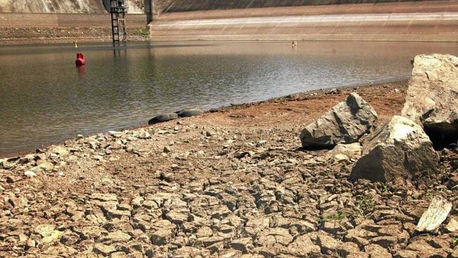 A nearly empty Borumba Dam in November 2002. Gympie landowner Ted Uebergang says some areas of the region are suffering just as much today. Picture: Renee Pilcher