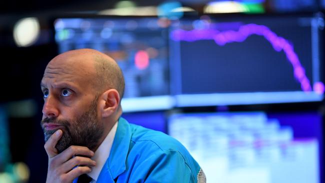 A trader on the floor of the New York Stock Exchange as the market crashed in March. Picture: AFP