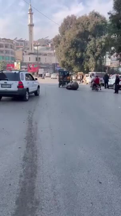 Head of Hafez al-Assad Statue Dragged Through Streets of Hama