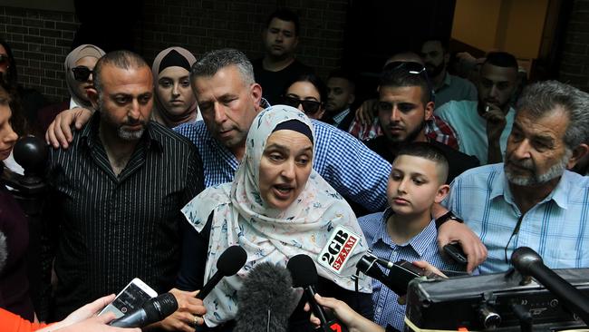 Mahmoud Hrouk's mother Maha Dunia (centre) speaks to the media outside the NSW Supreme Court. Picture: AAP Image/Ben Rushton