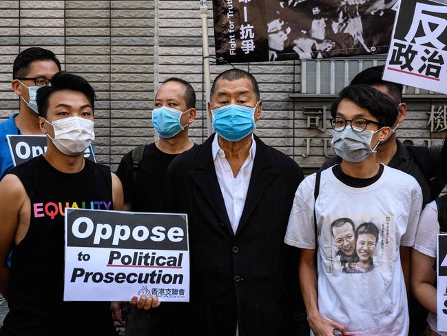 Thirteen prominent Hong Kong democracy activists appeared in court on July 13 charged with holding an unauthorised gathering to mark the Tiananmen Square crackdown. Picture: AFP