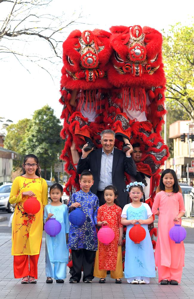 With the Australian Chinese Teo-Chew Association dancers and Fairfield Mayor, Frank Carbone, Krystal Truong, Katie Nguyen, Alistair Tran, Lily Nguyen, Julie Nguyen and Audrey Tran at the Freedom Plaza, Cabramatta in 2017. Picture: Simon Bullard