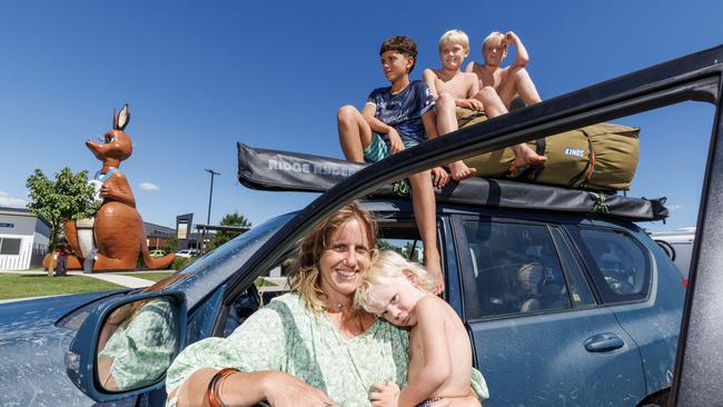 Mum of six Jess Young with Reef 2, twins Ace and Jet 12, and friend Benji Blumson 12, taking a break from the highway at Traveston on the way home from holidaying at Inskip Point. Picture Lachie Millard