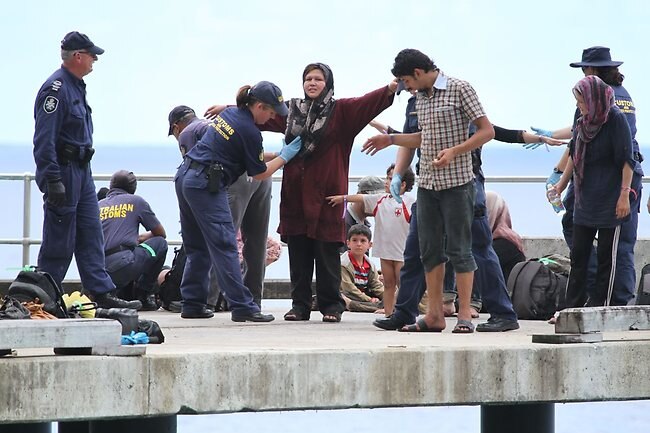 Asylum-seekers arrive and are screened by Customs officials at Christmas Island Picture: Kent Retallick