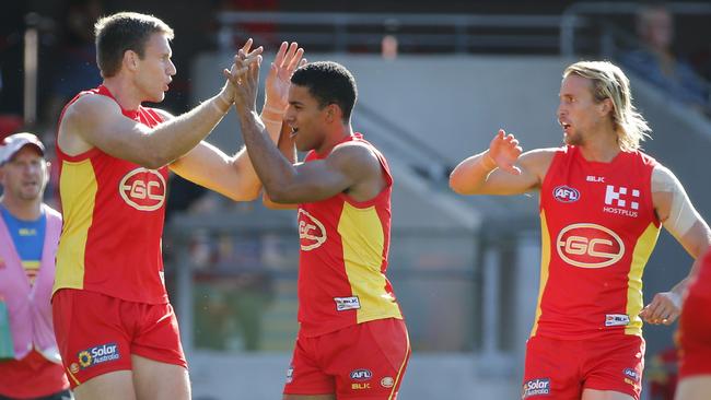 Sam Day of the Suns celebrates after scoring a goal during Round 18 AFL match between the Gold Coast Suns and Fremantle Dockers at Metricon Stadium, Gold Coast Saturday, July 23, 2016. (AAP Image/Glenn Hunt) NO ARCHIVING, EDITORIAL USE ONLY