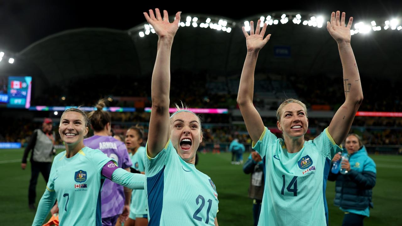 MELBOURNE, AUSTRALIA - JULY 31: Steph Catley, Ellie Carpenter and Alanna Kennedy of Australia applaud fans after the team's 4-0 victory and qualification for the knockout stage following the FIFA Women's World Cup Australia &amp; New Zealand 2023 Group B match between Canada and Australia at Melbourne Rectangular Stadium on July 31, 2023 in Melbourne / Naarm, Australia. (Photo by Alex Pantling - FIFA/FIFA via Getty Images)