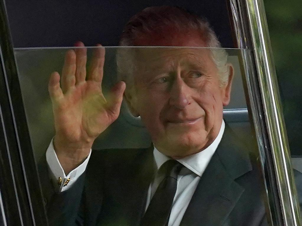 King Charles III waves to the crowds after leaving Clarence House. Picture: AFP.