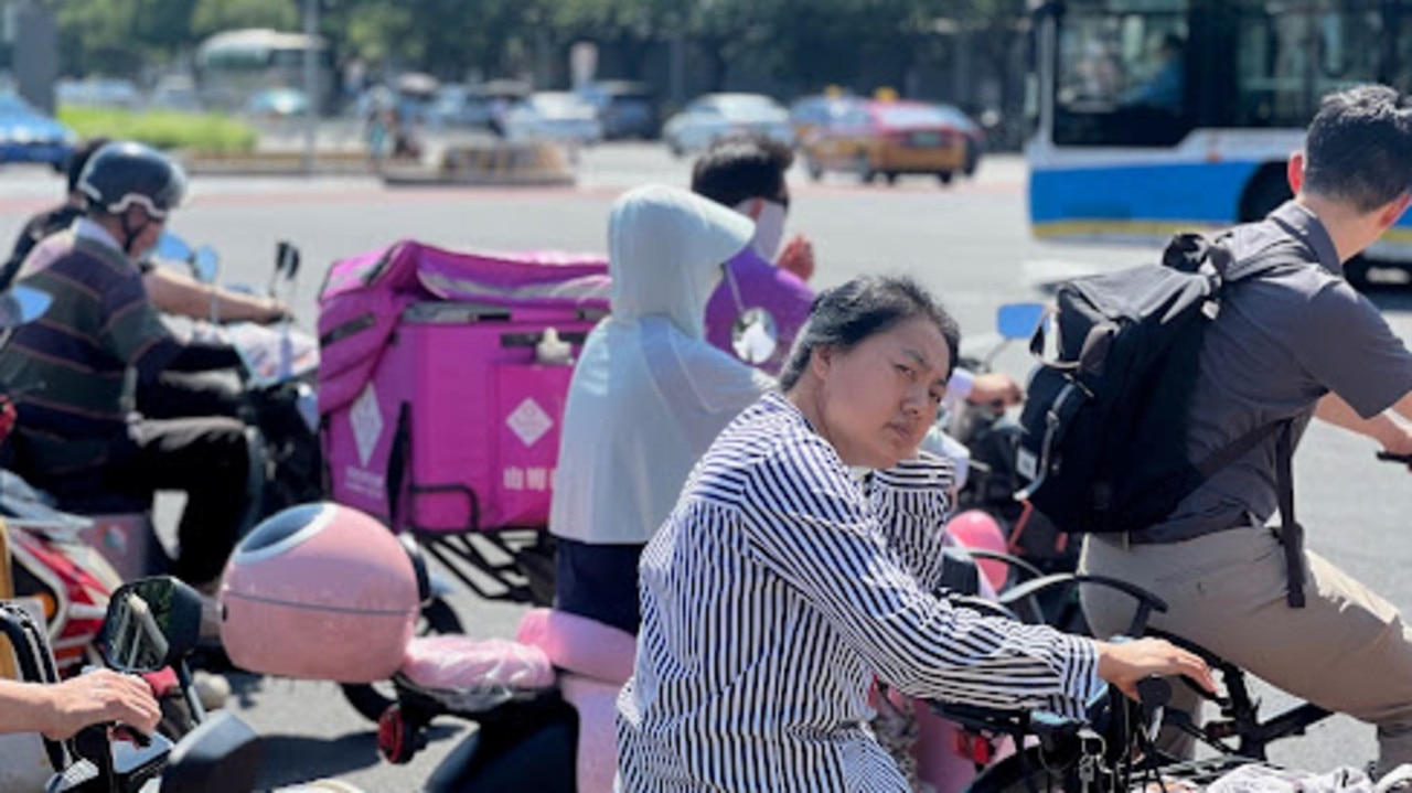 Beijing traffic is mesmerising to watch from the sidelines. Picture: Josh Jennings