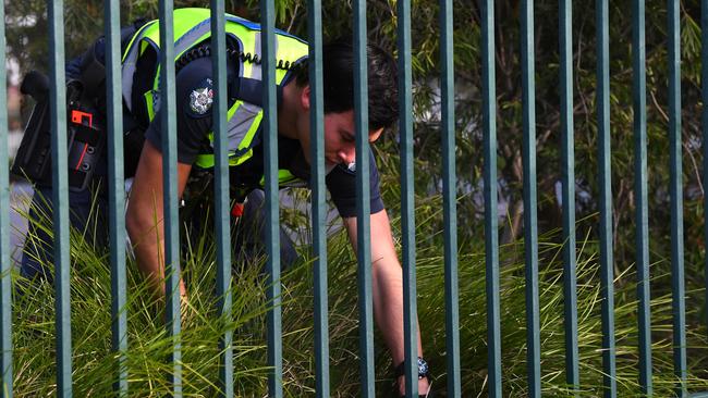 Victorian Police officers search near where Solomone was killed. Picture: AAP