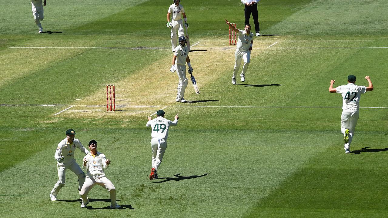 The Australian celebrate the dismissal of Joe Root. Photo by Quinn Rooney/Getty Images