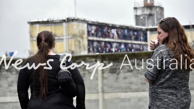 Cassandra Sainsbury's mother and sister behind the jail El Buen Pastor in Bogota. Women are only allowed to visit the jail on Sundays, so it’s likely they might have to wait to see her. Photographer: Guillermo Legaria