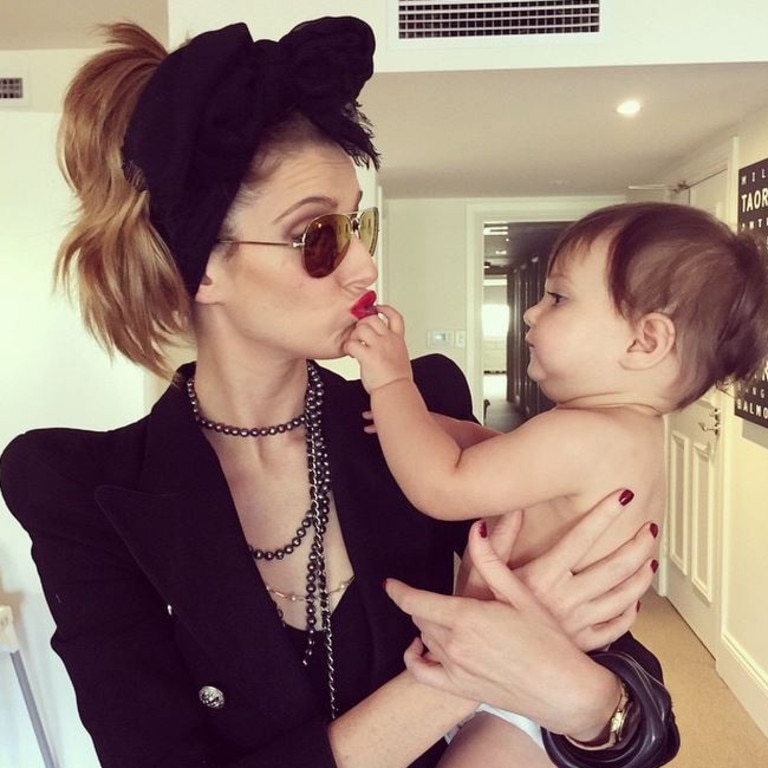 MOTHER'S DAY SPECIAL... Media personality Kate Waterhouse with her baby daughter, "Sophia's not sure about this 80s theme." Picture: Instagram Picture: Instagram