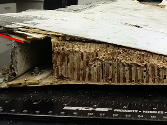 An undated combo photo handout received on October 7, 2016, shows a trailing edge section of Boeing 777 left, outboard flap, originating from the Malaysian Airlines aircraft registered 9M-MRO (MH370), the Australian Transport Safety Bureau (ATSB) said in a report. The piece of debris found in Mauritius is from MH370, Australia said, with the wing part the latest fragment discovered along western Indian Ocean shorelines that has been linked to the missing passenger jet. / AFP PHOTO / ATSB / STR