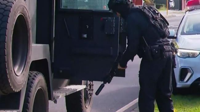 A man has been charged with murder after allegedly killing a woman during a four-hour siege in Adelaide's northeast on Saturday. Picture: Nine News