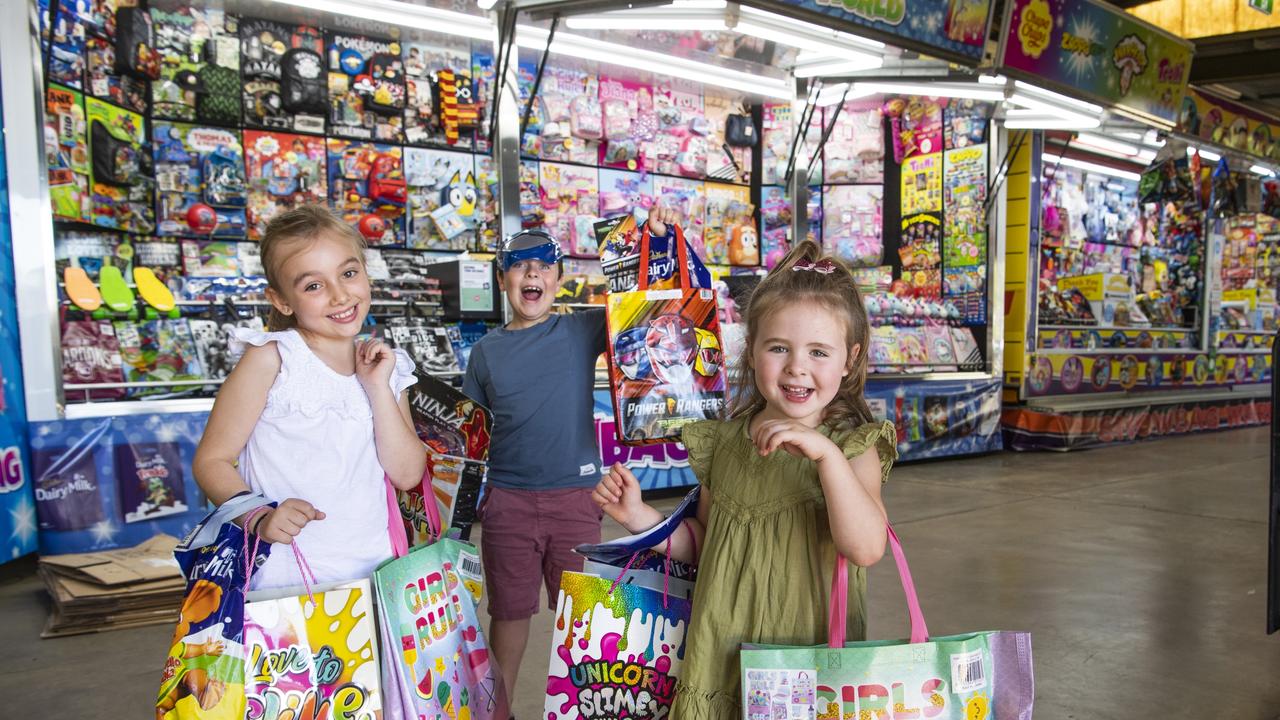 Addison, Ty and Harper Phillips find their favourite showbags at the Toowoomba Royal Show. Picture: Nev Madsen.